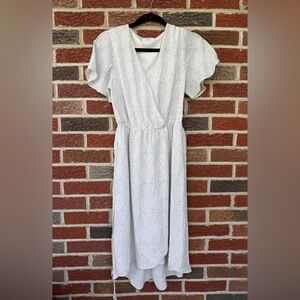 Like New- White and Black Polkadot Dress. Size is a medium (juniors).